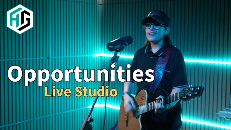 Opportunities live studio video artwork showing Holden Garcia singing into a microphone and playing guitar under teal lighting.