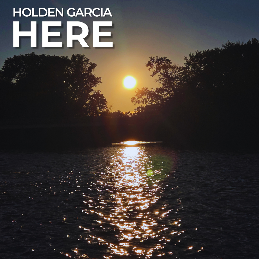 Here by Holden Garcia, cover artwork showing sunlight reflected on water between silhouetted trees.